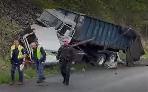 Garbage truck crash in Troy shuts down multiple roads